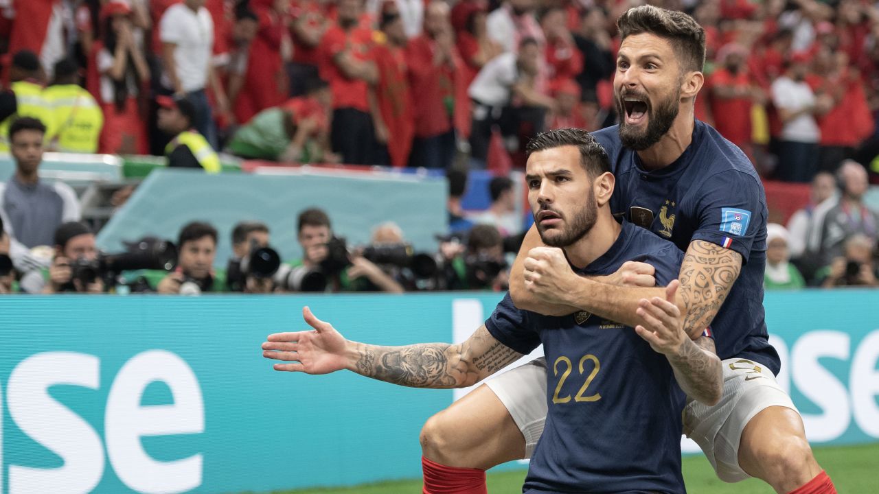Theo Hernández celebrates with Olivier Giroud after scoring for France against Morocco during the 2022 World Cup semifinal.