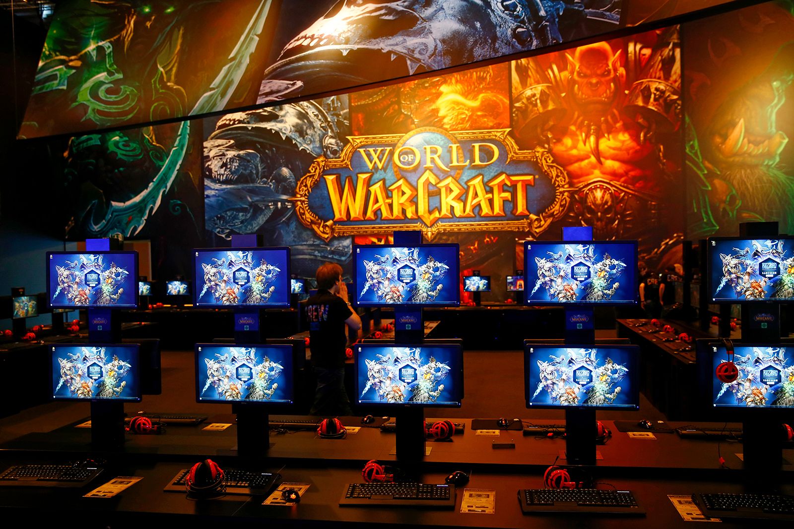 visitors play the game „World of Warships“ at gamescom , world's