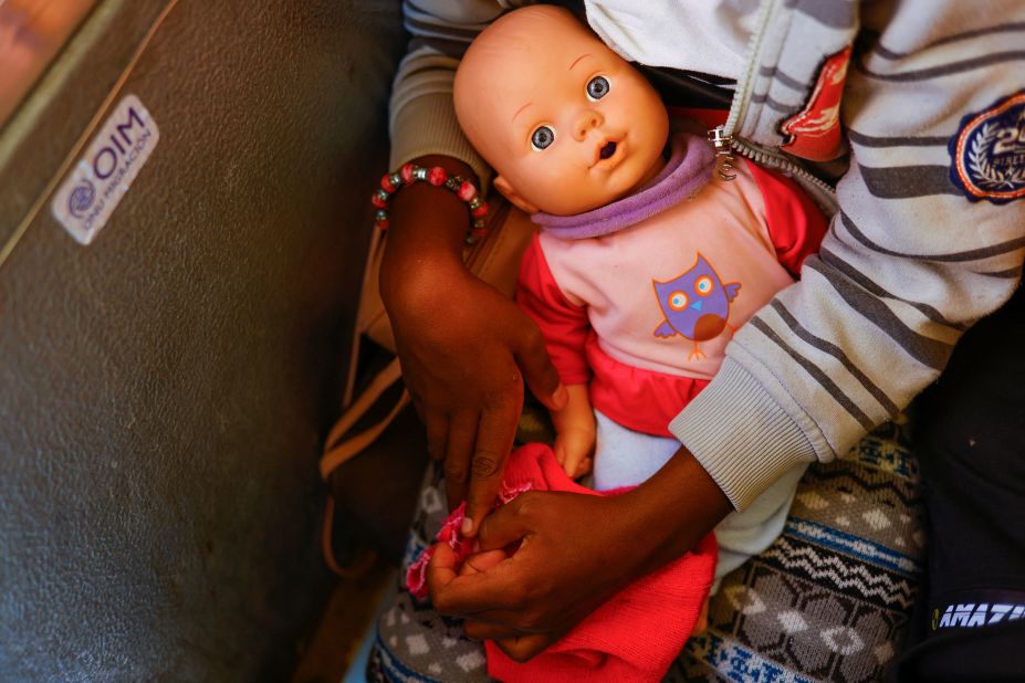 A young migrant girl carries a doll on a bus in Jimenez, Mexico, while she tries to reach the United States to request asylum on December 10.