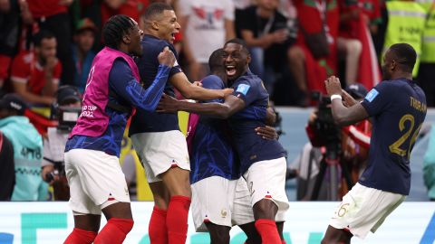 Kolo Muani celebrates with teammates after scoring France's second goal against Morocco.