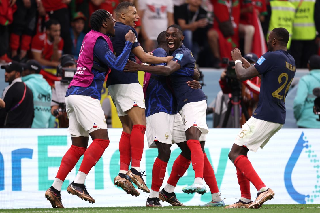 Kolo Muani celebrates with teammates after scoring France's second goal against Morocco.