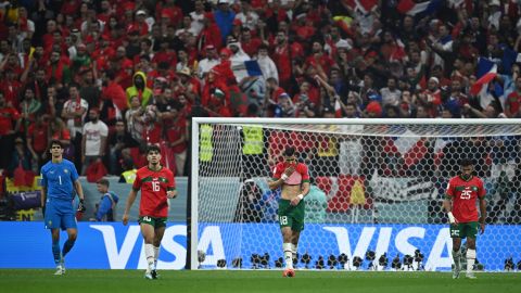 Moroccan players look desolate after conceding a goal to France.