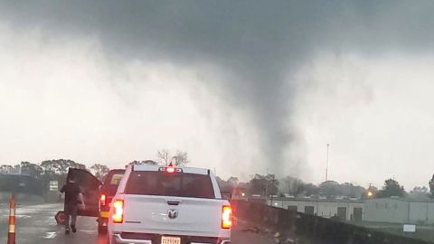 A tornado crosses a highway in New Iberia, Louisiana, Wednesday.