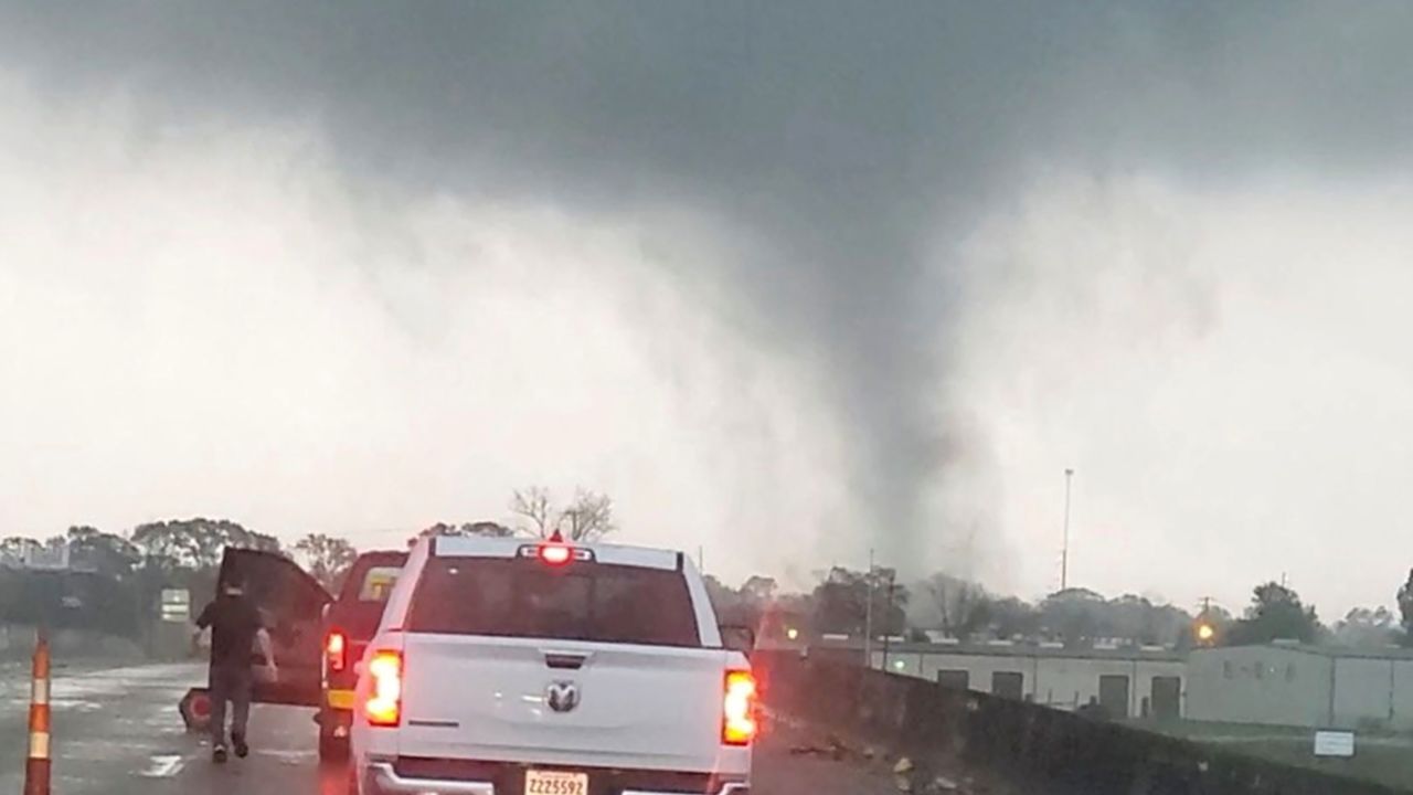 A tornado passes a highway Wednesday in New Iberia, Louisiana.