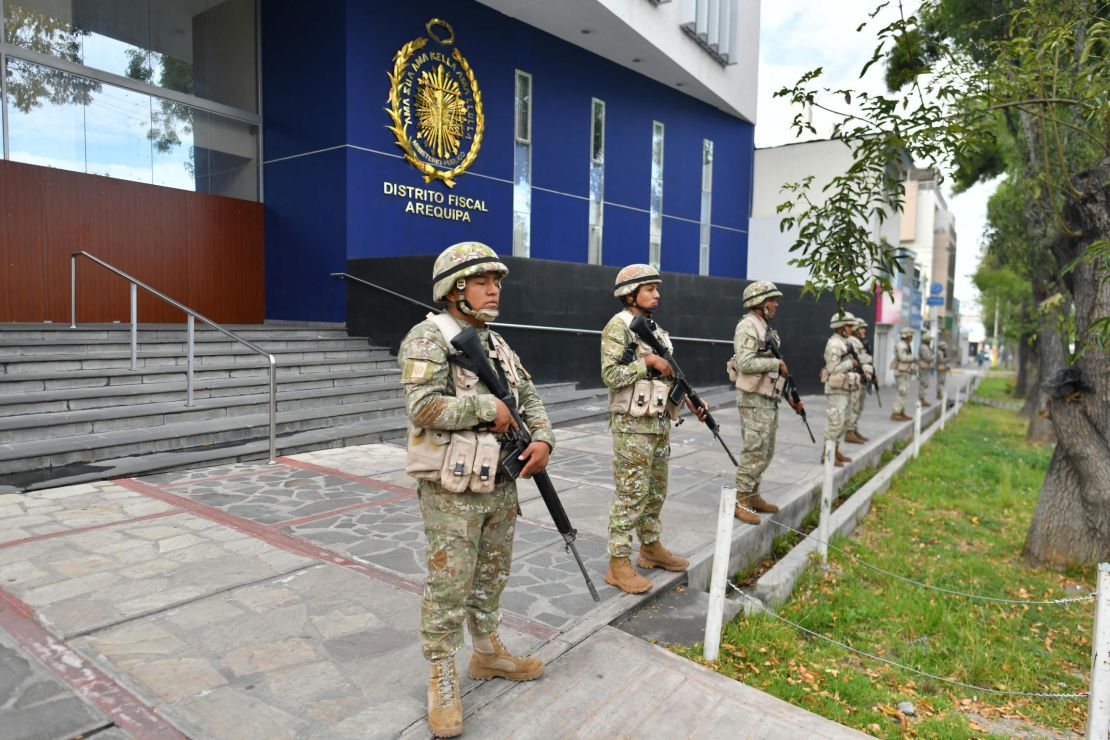 The military stand guard at an official building after demonstrations turned violent.