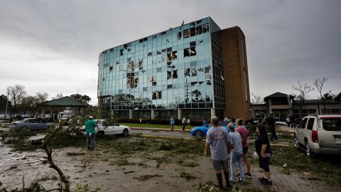 People survey damage following a tornado at the Iberia Medical Center on Wednesday, December 14, 2022, in New Iberia, Louisiana.