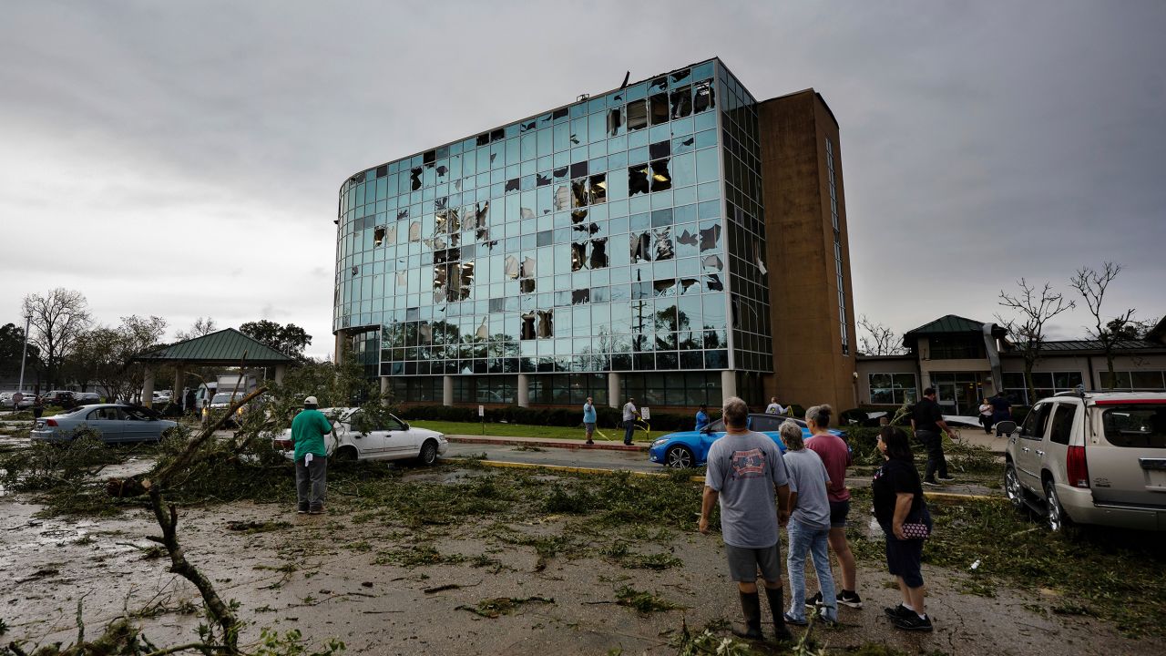 People survey damage following a tornado at the Iberia Medical Center on Wednesday, December 14, 2022, in New Iberia, Louisiana. 