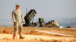 A US soldier stands near a Patriot missile system at a Turkish military base in Gaziantep on February 5, 2013. The United States, Germany and the Netherlands committed to send two missile batteries each and up to 400 soldiers to operate them after Ankara asked for help to bolster its air defences against possible missile attack from Syria.     AFP PHOTO / BULENT KILIC        (Photo credit should read BULENT KILIC/AFP via Getty Images)