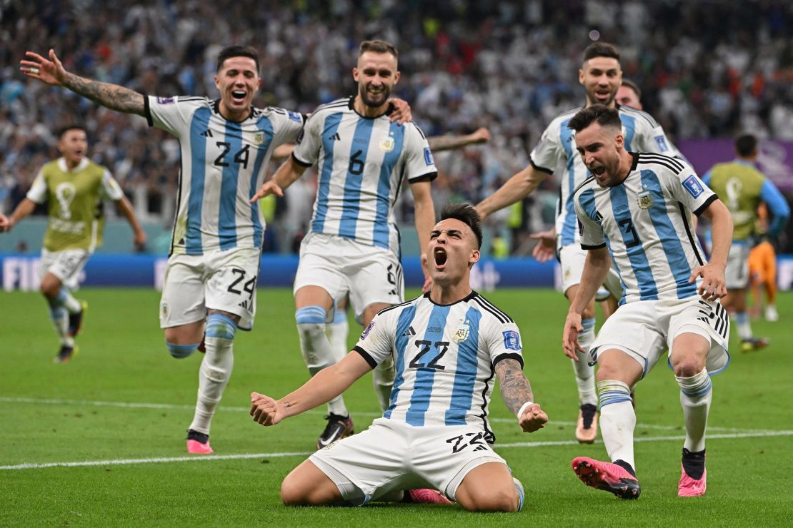 Argentina's forward Lautaro Martinez celebrates after scoring his spot kick and defeating Netherlands in the penalty shootout. 