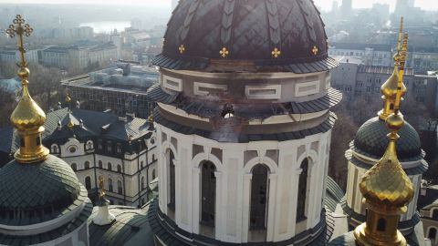 A shell hole exploded in the dome of a church in Donetsk after what Russian-backed officials said was shelling by Ukrainian forces on Thursday.