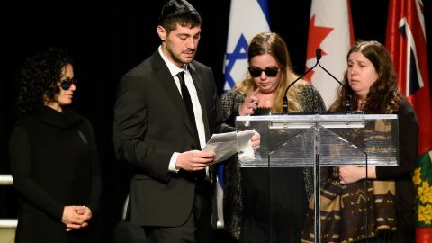 Jonathon Sherman speaks during a December 21, 2017, memorial service for his parents, Barry and Honey Sherman, as his three sisters look on.