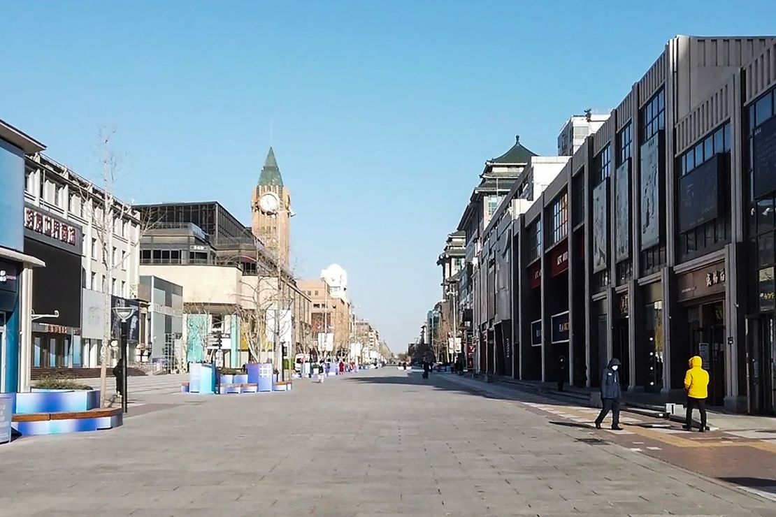 This frame grab from AFPTV video footage shows an almost empty street in the Wangfujing shopping district in Beijing on December 13, 2022.