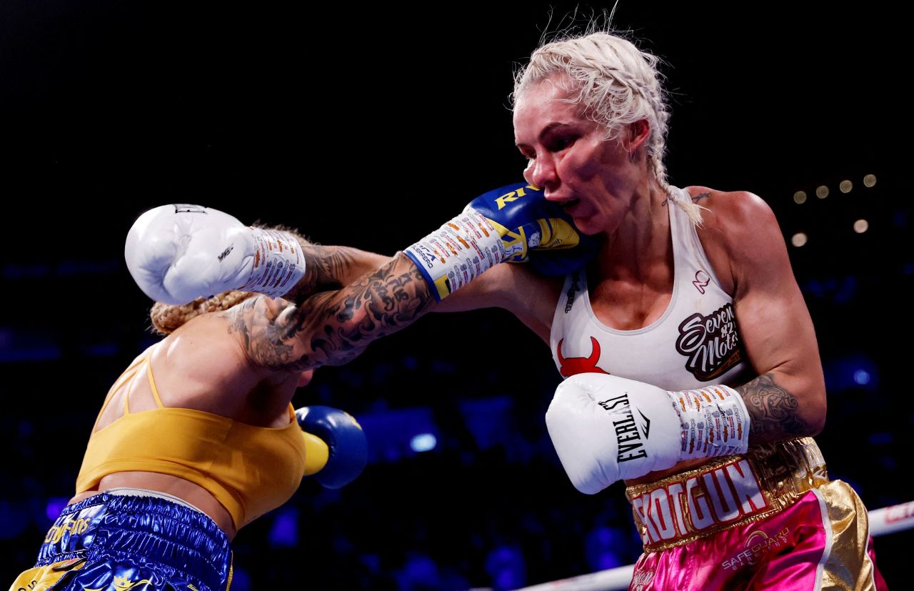 Ebanie Bridges, left, punches Shannon O'Connell during their title fight in Leeds, England, on Saturday, December 10. Bridges stopped O'Connell in the eighth round to retain her IBF bantamweight crown.