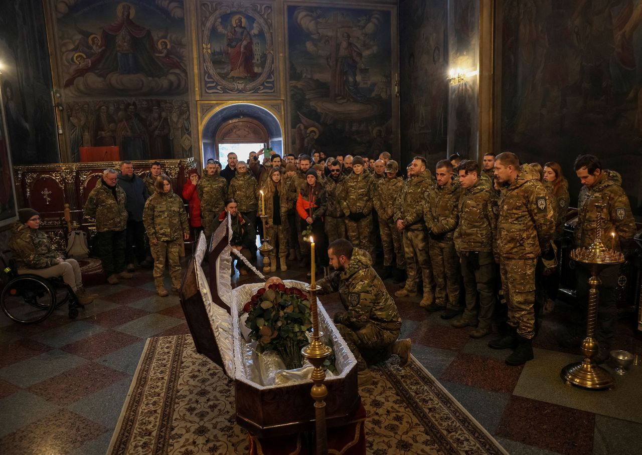The Hospitallers, a volunteer paramedic organization in Ukraine, attend a memorial service for one of their members, a 20-year-old Swedish citizen named Niko, at a cathedral in Kyiv, Ukraine, on Tuesday, December 13. He was killed in an accident near Bakhmut, Ukraine, <a href="https://www.hospitallers.org.uk/post/lack-of-monocular-resulted-in-death-of-the-volunteer-hospitaller-from-sweden" target="_blank" target="_blank">the organization said</a>. 