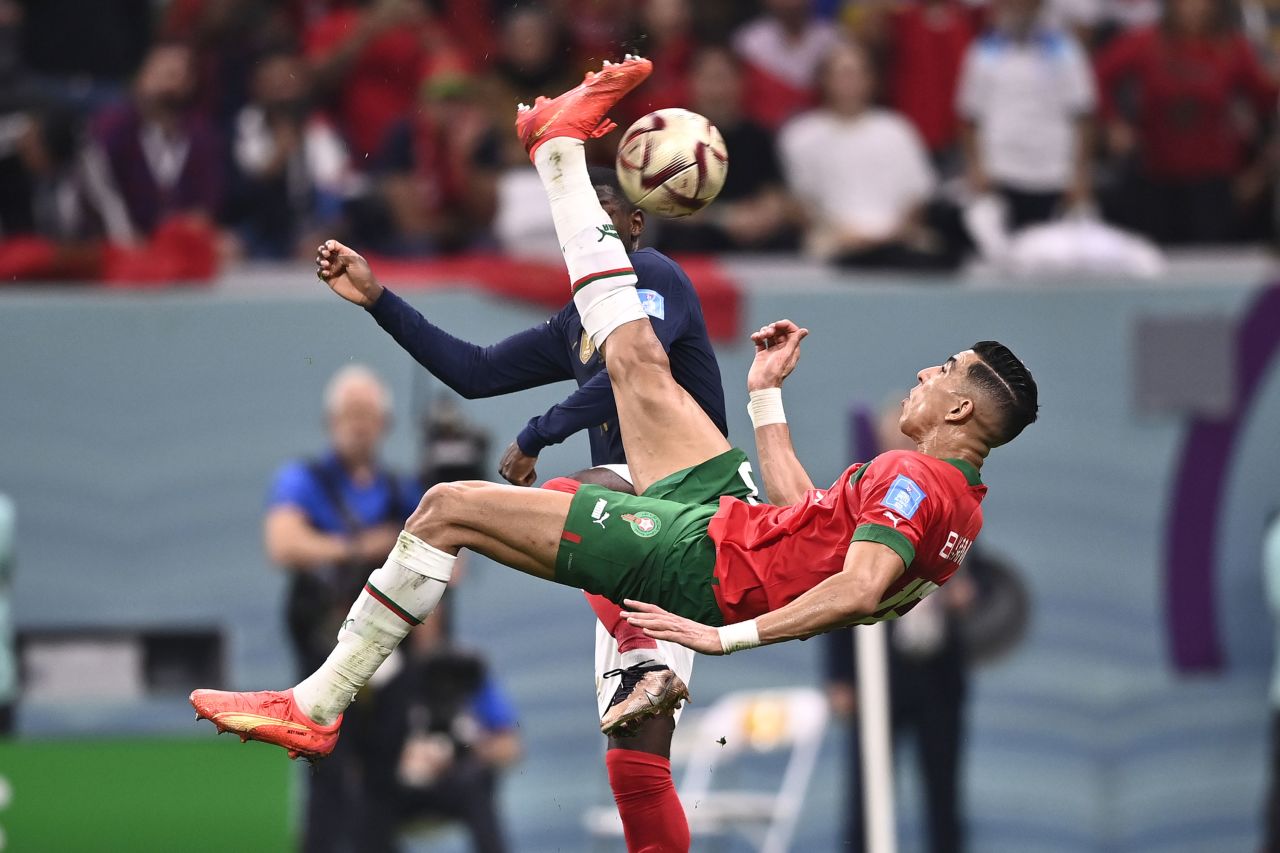 Morocco's Jawad El Yamiq attempts a bicycle kick during the World Cup semifinal against France on Wednesday, December 14. His shot clanged off the post.