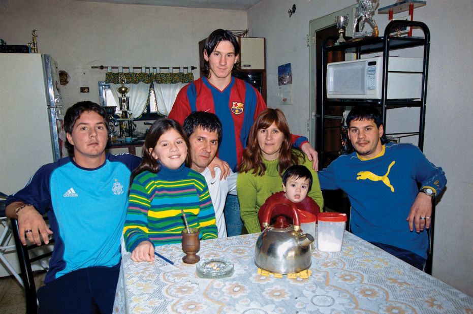 Messi, top, poses with members of his family in Rosario in 2003. Below him, from left, are brother Rodrigo, sister Maria Sol, father Jorge, mother Celia, nephew Tomás and brother Matías. As a young boy, Messi was diagnosed with a growth hormone deficiency. He played for the local club team, Newell's Old Boys, before signing with Spanish club FC Barcelona at age of 13. As part of the contract, Barcelona agreed to pay for Messi's hormone treatments.