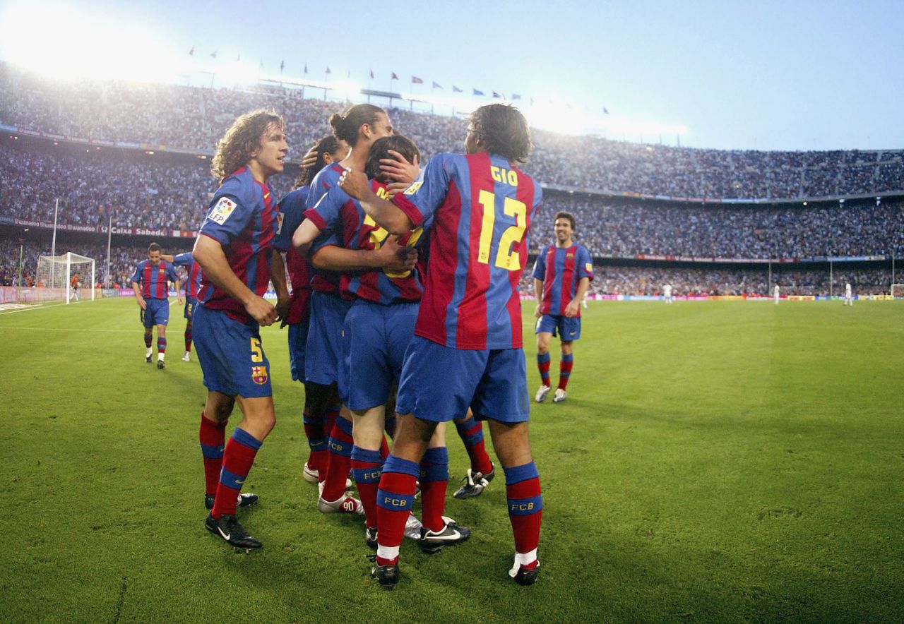 Messi is congratulated by Barcelona teammates after scoring his first goal for the club on May 1, 2005. Messi was 17 years old.
