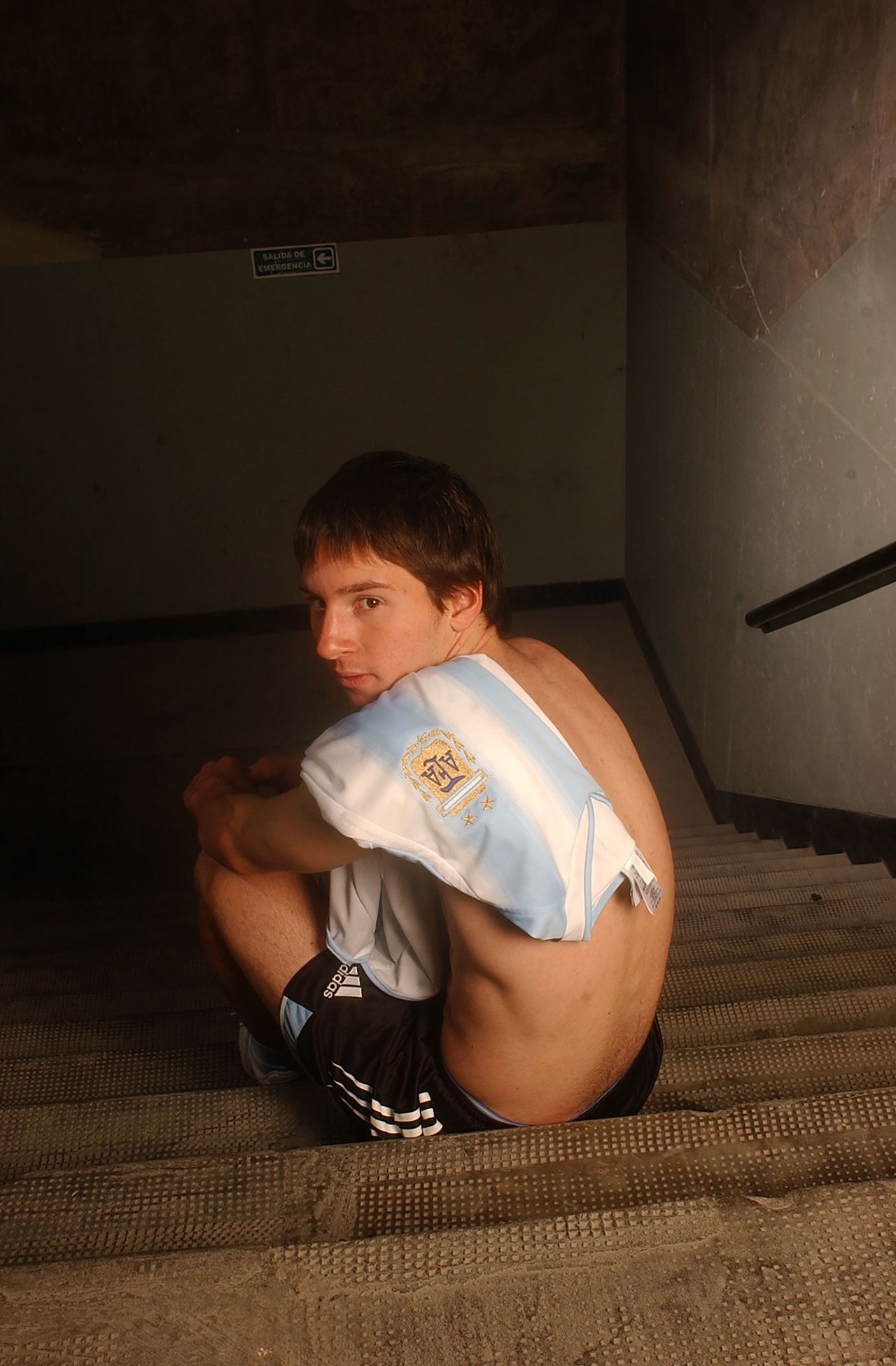 Messi poses with an Argentina shirt for the magazine El Gráfico in June 2005. He would make his senior debut for his country a couple of months later.