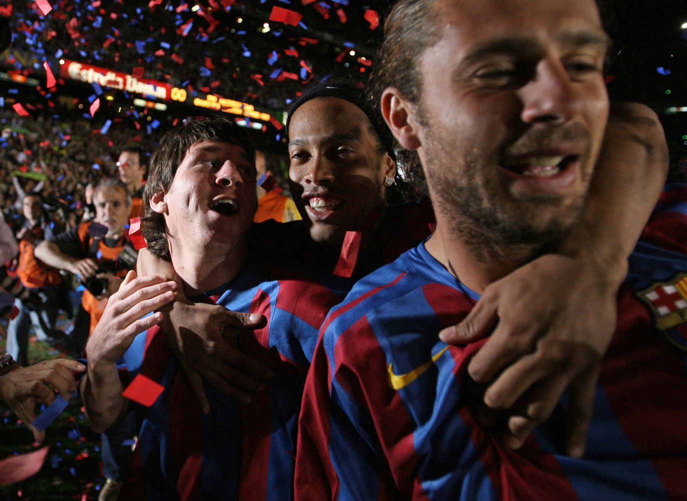 Messi, left, celebrates with teaммates Ronaldinho, center, and Rafael Márquez after Barcelona won the Spanish league title in May 2006. Less than two weeks later, Barcelona won the Chaмpions League — Messi's first with the cluƄ.