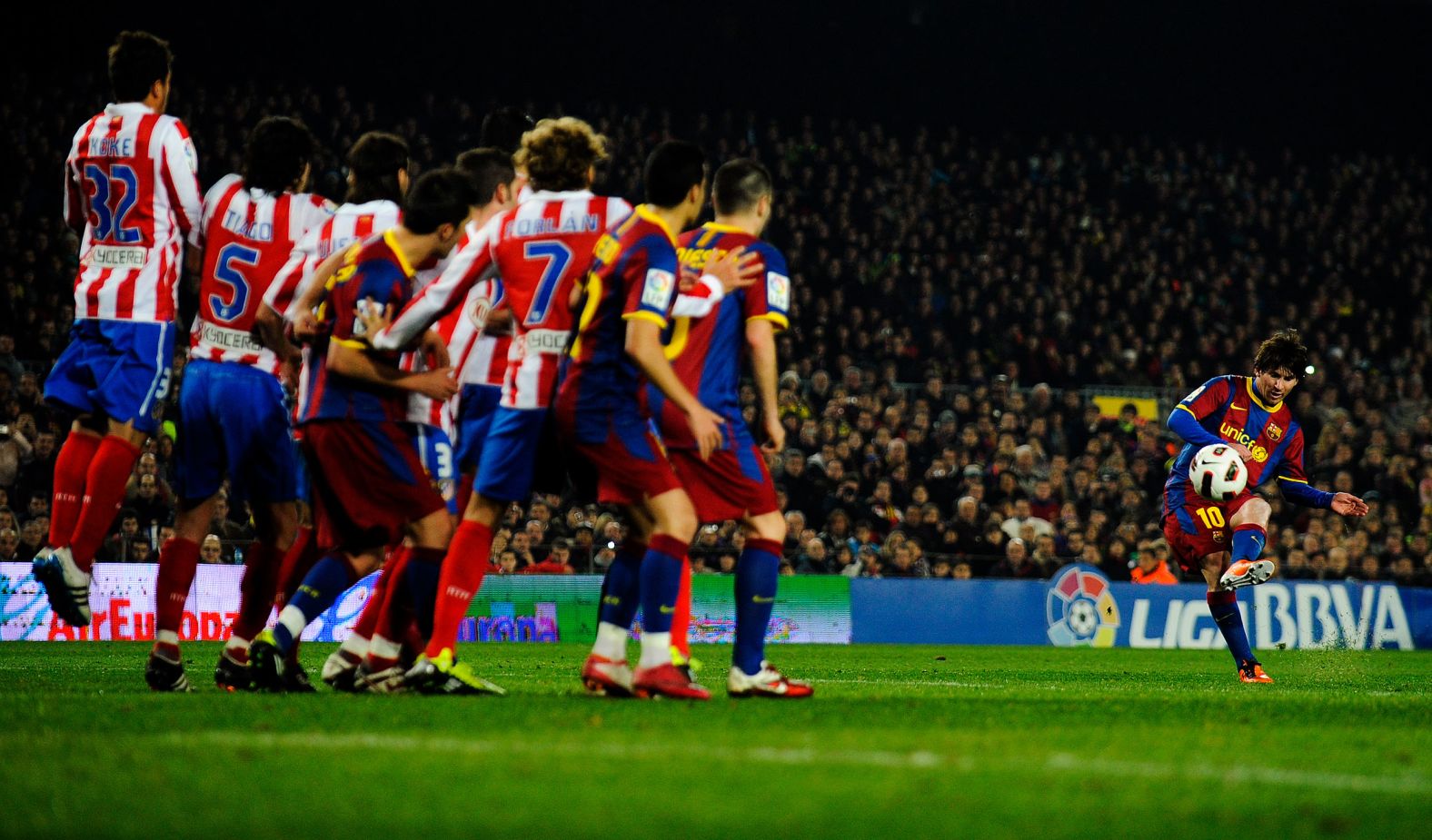 Messi takes a free kick during a Spanish league match against Atlético Madrid in 2011. During the 2011-12 season, Messi scored 73 goals, setting the all-time record for most goals scored in a season for a major European football league.