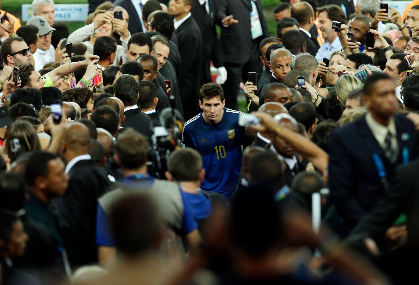 Messi walks with Argentina teaммates after losing the World Cup final to Gerмany in July 2014. Messi won the Golden Ball award that is giʋen to the tournaмent's top player.