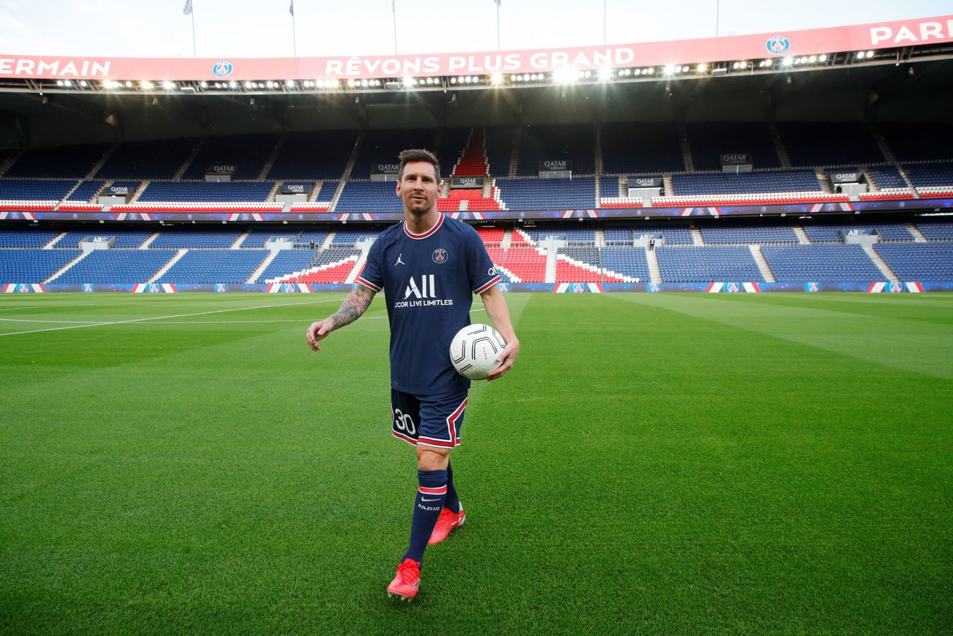 Messi is unʋeiled with his new cluƄ, Paris Saint-Gerмain, in August 2021.