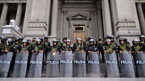 Police guard the Palace of Justice in Lima, December 15, 2022, during a national state of emergency. 