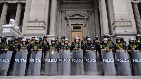 Police guard the Justice Palace in Lima, on December 15, 2022, during a nationwide state of emergency.