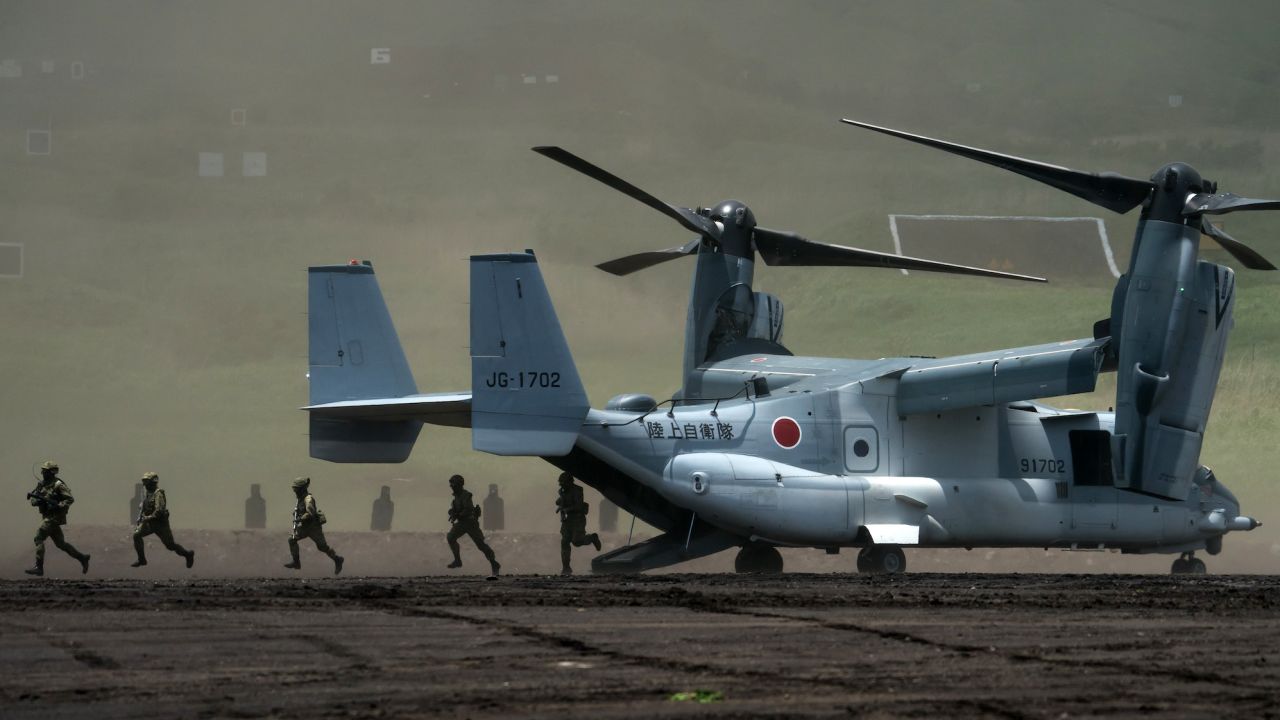 Members of the Japan Ground Self-Defense Force disembark from a V-22 Osprey aircraft during a live fire exercise in Gotemba, Japan, on May 28, 2022.