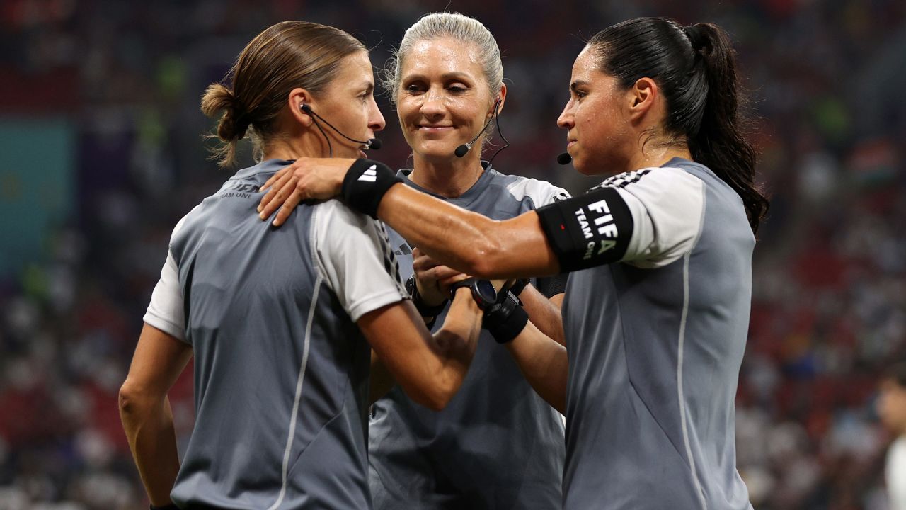 Referees Stephanie Frappart, Neuza Ines Back, and Karen Diaz Medina shake hands as they warm up prior to the Group E match between Costa Rica and Germany.