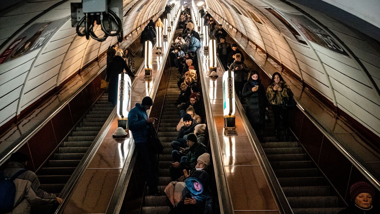 Civilians shelter inside a metro station during an air raid alert in the centre of Kyiv.