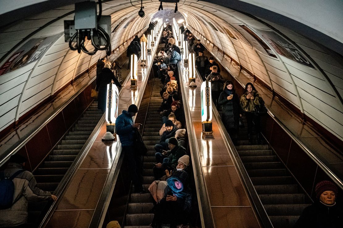 Civilians shelter inside a metro station during an air raid alert in the centre of Kyiv.