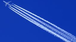 A Qatar Airways Airbus A 340 airplane leaves contrails in the clear sky of Altenmarkt Zauchensee on January 11, 2014. AFP PHOTO / ALEXANDER KLEIN        (Photo credit should read ALEXANDER KLEIN/AFP via Getty Images)