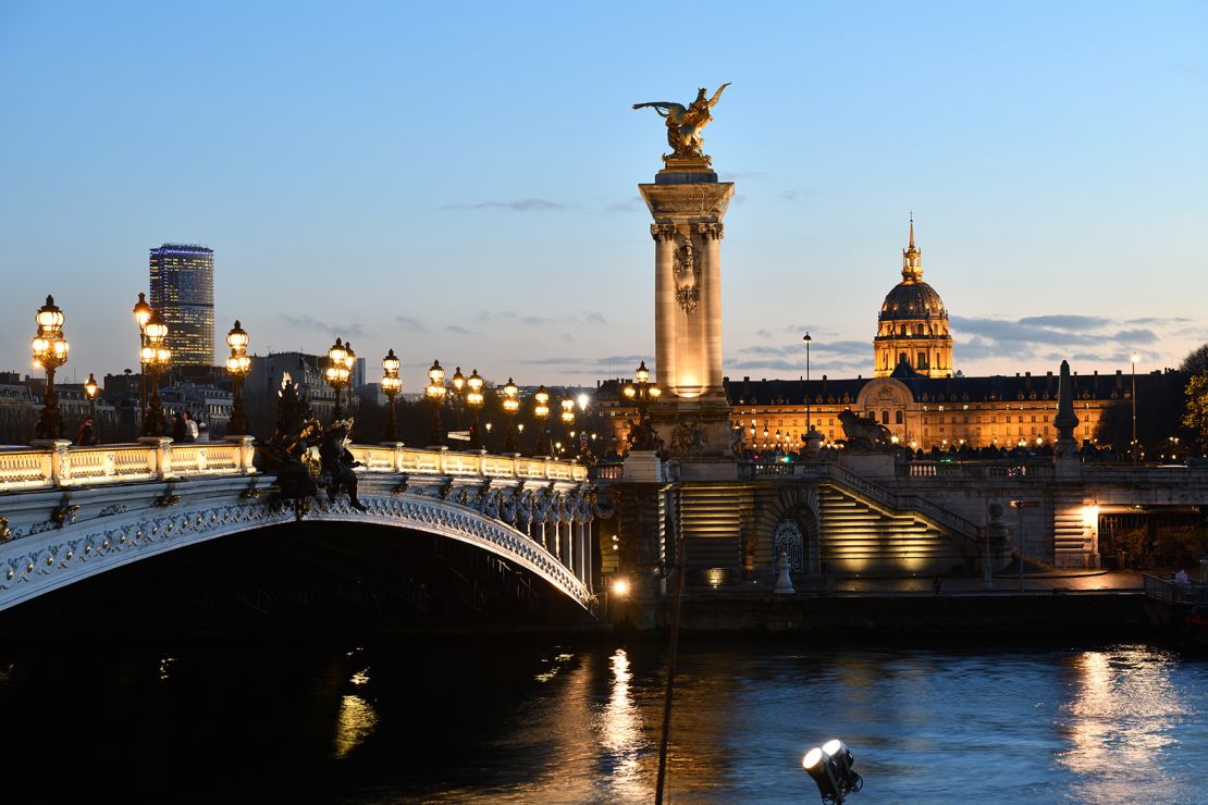 The illuminated Pont Alexandre III spans the Seine, adding to the magic of Paris in winter.