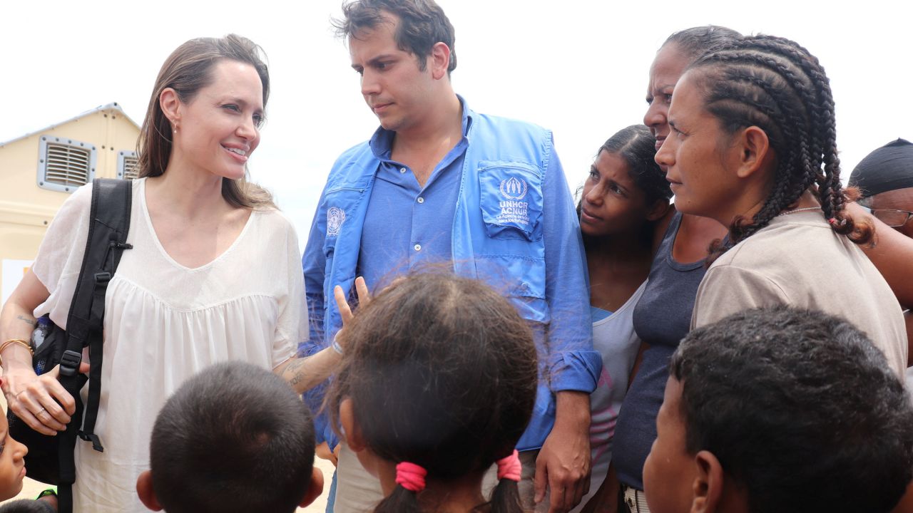 Special envoy Angelina Jolie talks to people inside a camp run by the UN Refugee Agency, UNHCR, in Maicao, Colombia, on June 8, 2019.