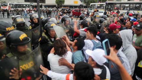 Protesters clash with police during a demonstration in Lima on Thursday.