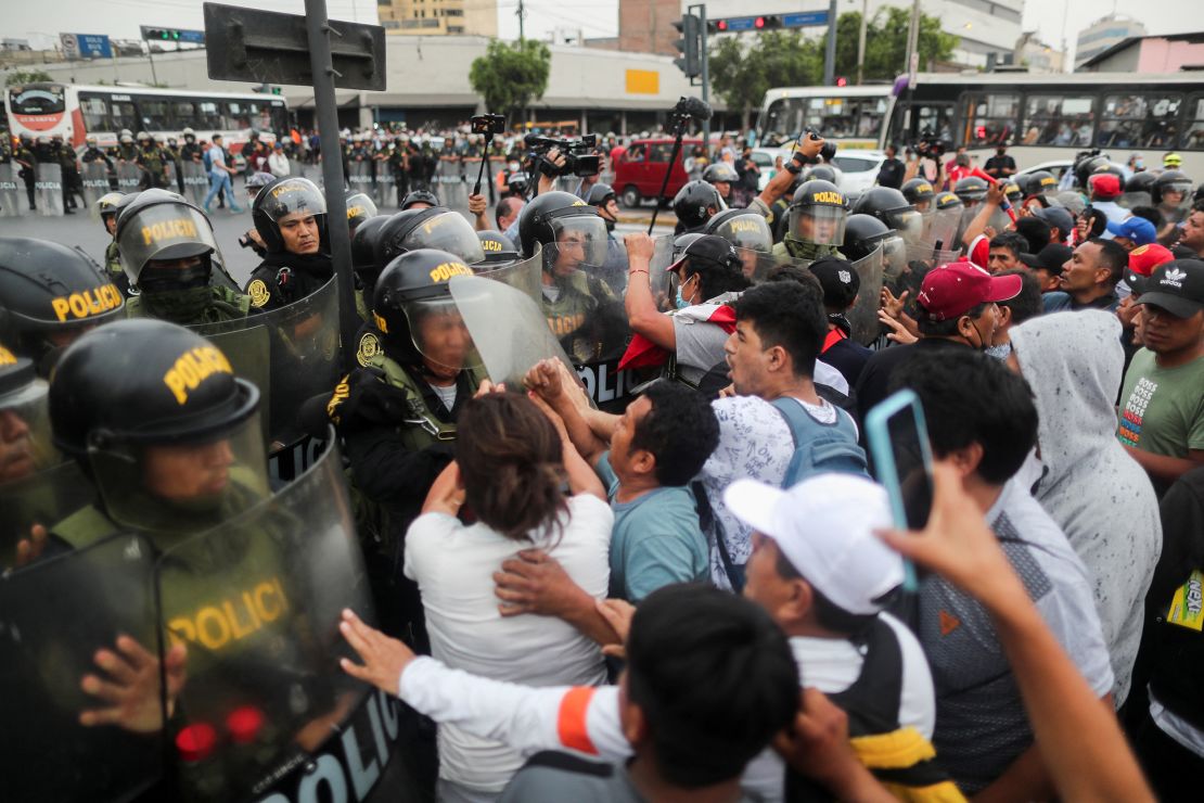 Demonstrators clash with police during a protest in Lima on Thursday.