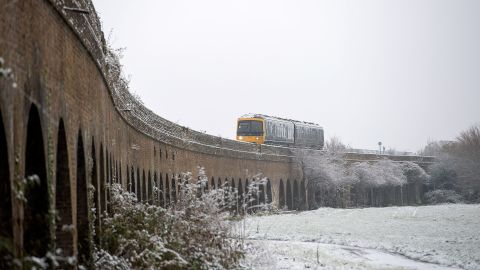 The UK rail sector is battling snowy weather while staff strike for better pay and working conditions.