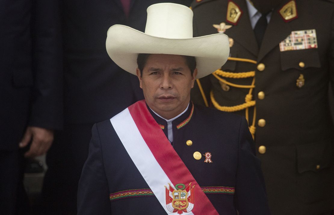 Peruvian President Pedro Castillo wears the presidential sash as he exits the Congress after his inauguration ceremony in Lima, on July 28, 2021. - Leftist Pedro Castillo was sworn in as Peru's fifth president in three years Wednesday on the 200th anniversary of the country's independence, promising an end to corruption and a new constitution. (Photo by Janine Costa / AFP) (Photo by JANINE COSTA/AFP via Getty Images)