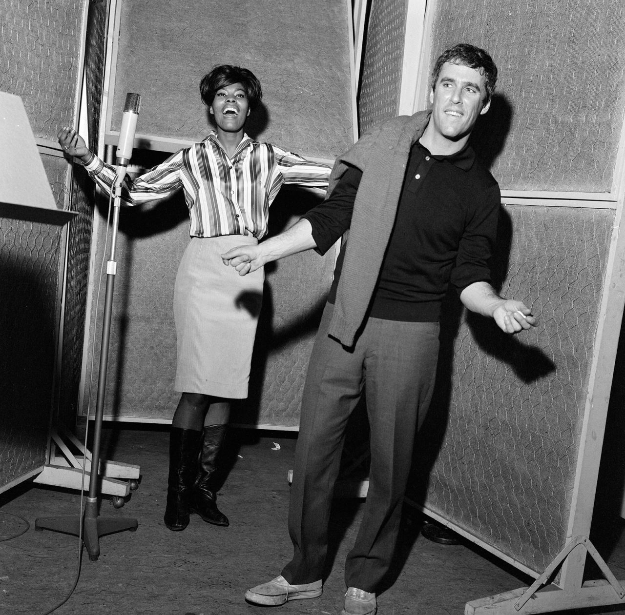 Warwick and songwriter Burt Bacharach record a song at Pye Studios in London in 1964. Warwick was discovered by Bacharach and fellow songwriter Hal David when she was 21. "Don't Make Me Over," Warwick's first Bacharach-penned hit song, was released in 1962.