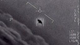 The image from video provided by the Department of Defense labelled Gimbal, from 2015, an unexplained object is seen at center as it is tracked as it soars high along the clouds, traveling against the wind. "There's a whole fleet of them," one naval aviator tells another, though only one indistinct object is shown. "It's rotating." The U.S. government has been taking a hard look at unidentified flying objects, under orders from Congress, and a report summarizing what officials know is expected to come out in June 2021. (Department of Defense via AP)