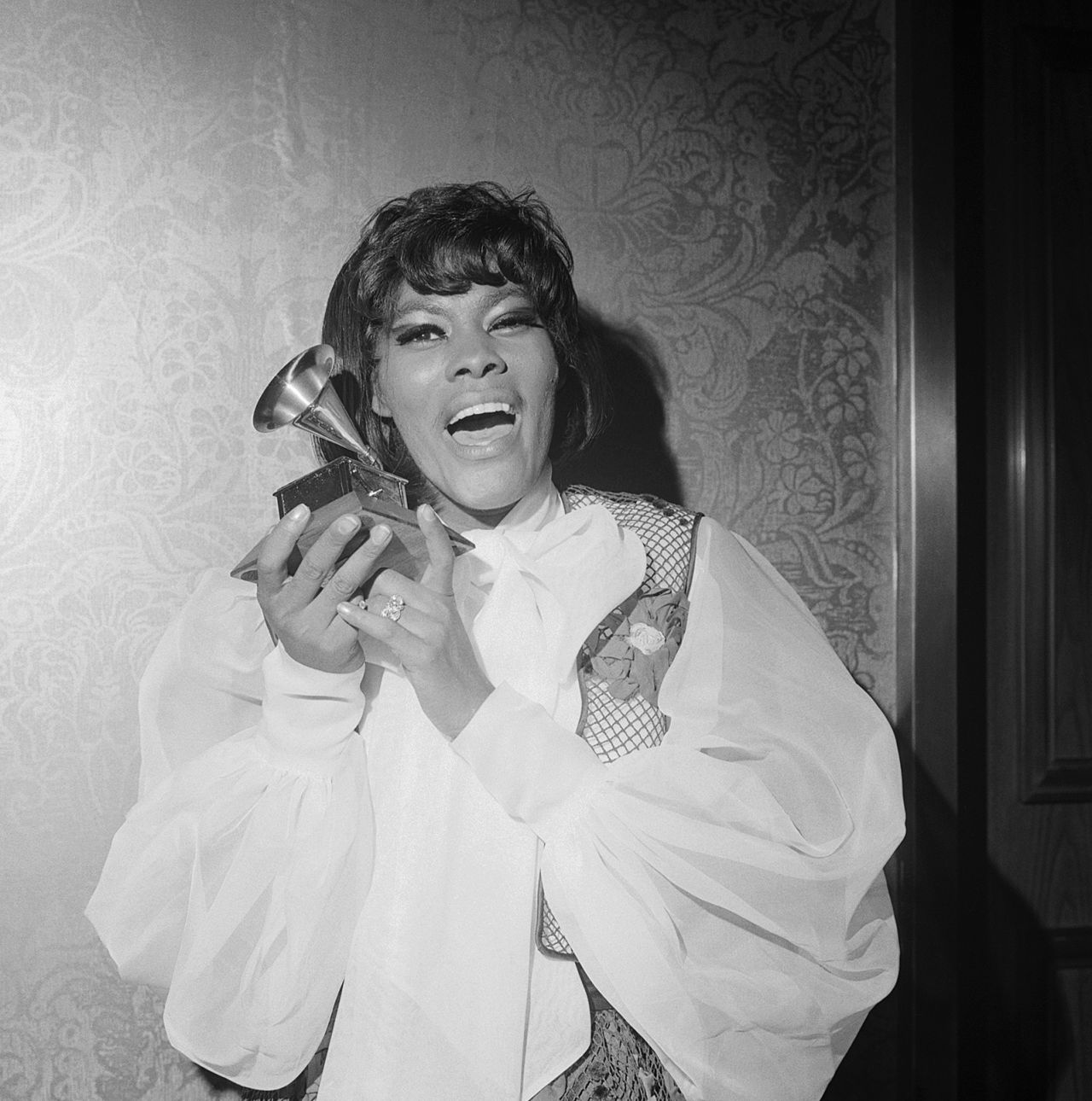 Warwick holds her first Grammy Award, which she won in 1969 for best female contemporary-pop vocal performance ("Do You Know the Way to San Jose").