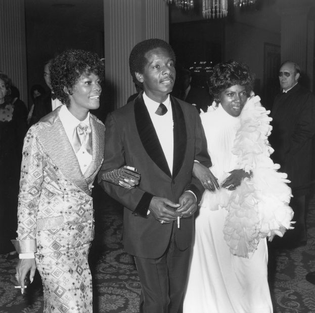 From left, Warwick; her husband, William; and her sister, Dee Dee, attend the Academy Awards in 1972. Warwick's sister was also a singer.