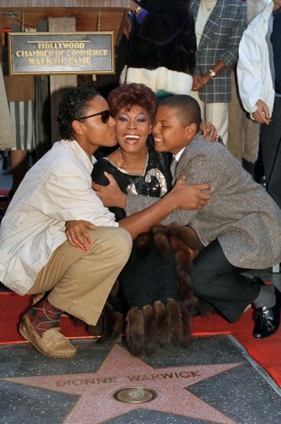 Warwick is embraced by her sons David, left, and Damon as she gets a star on the Hollywood Walk of Fame in December 1985.