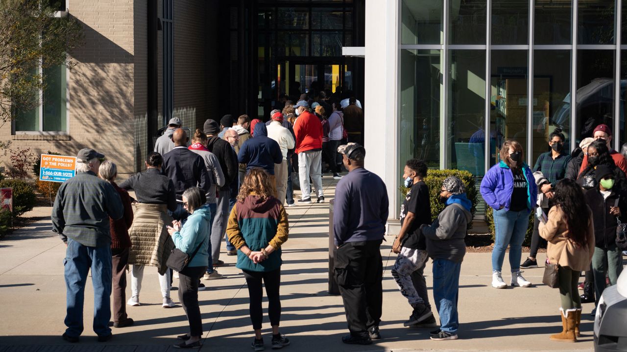 Voters line up at Metropolitan Library in Atlanta on November 29, 2022, to cast their ballots during early voting for the Senate runoff election in Georgia.