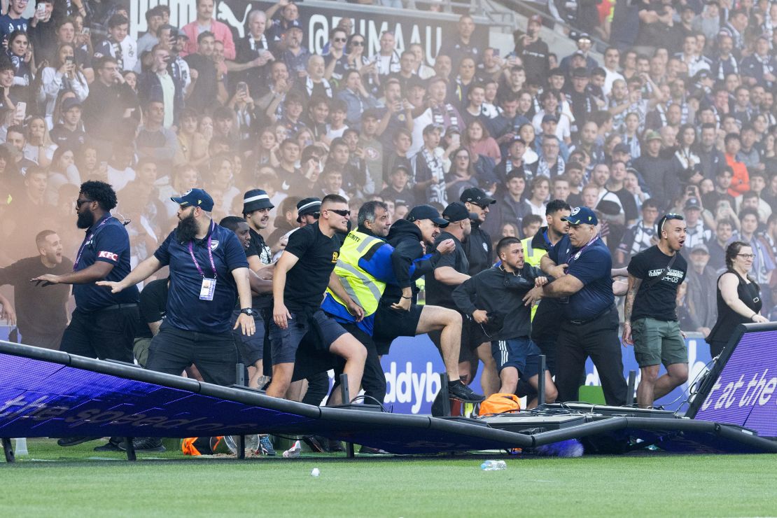 Fans invade the pitch during the game between Melbourne City and Melbourne Victory.