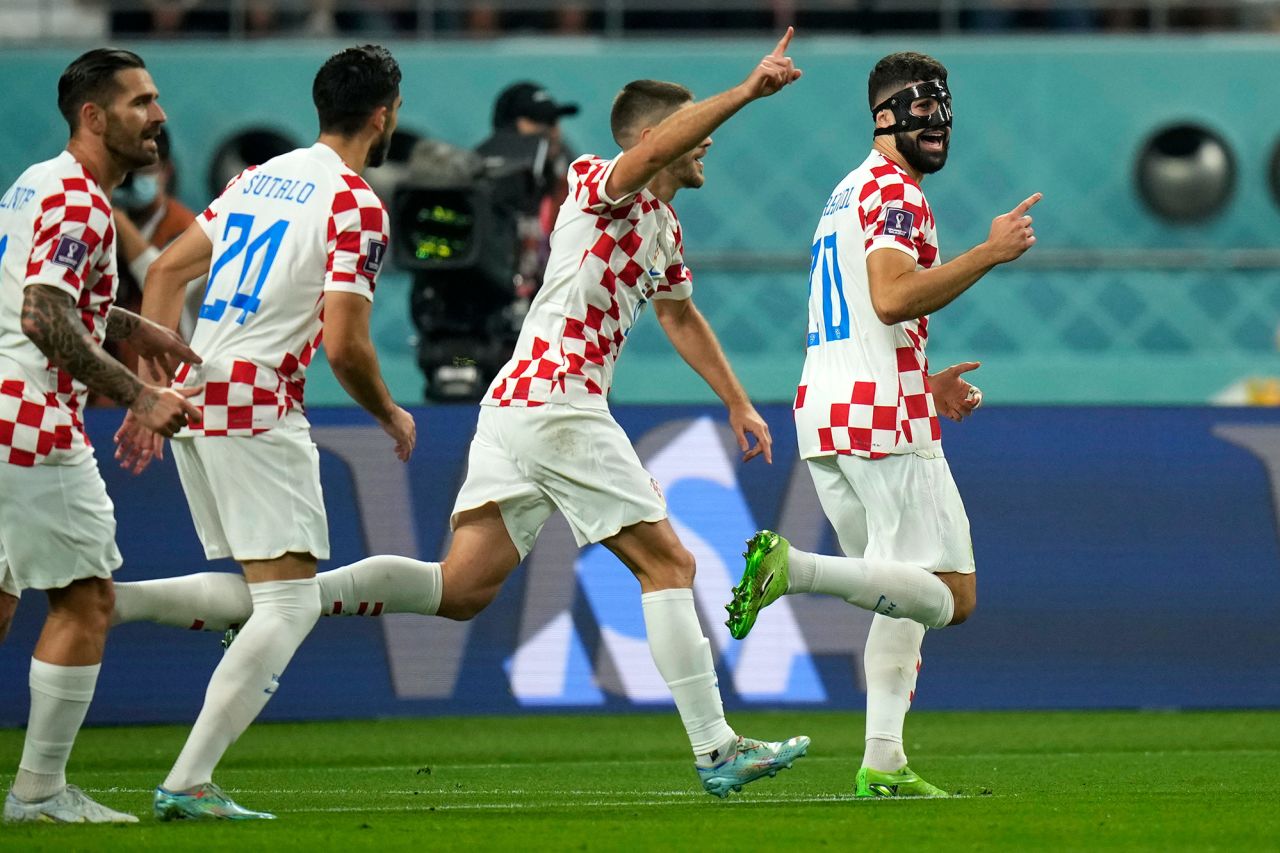 Croatia's Joško Gvardiol, right, celebrates after scoring his side's opening goal against Morocco. 