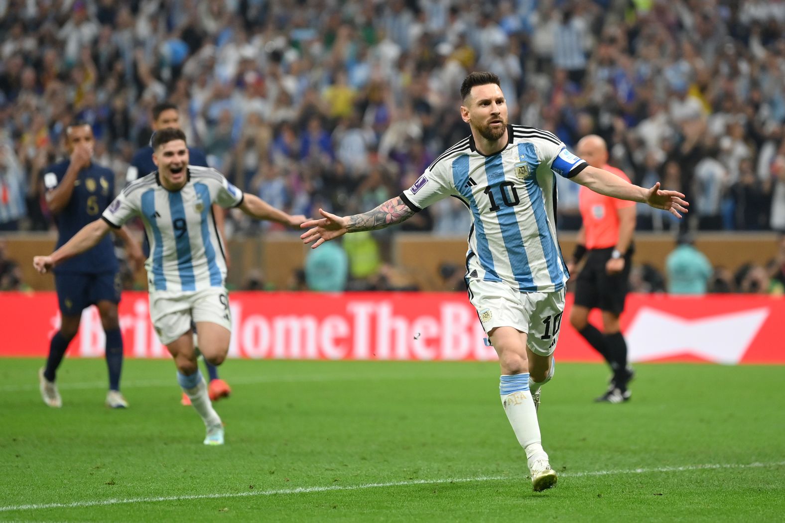 Messi celebrates after converting his penalty.