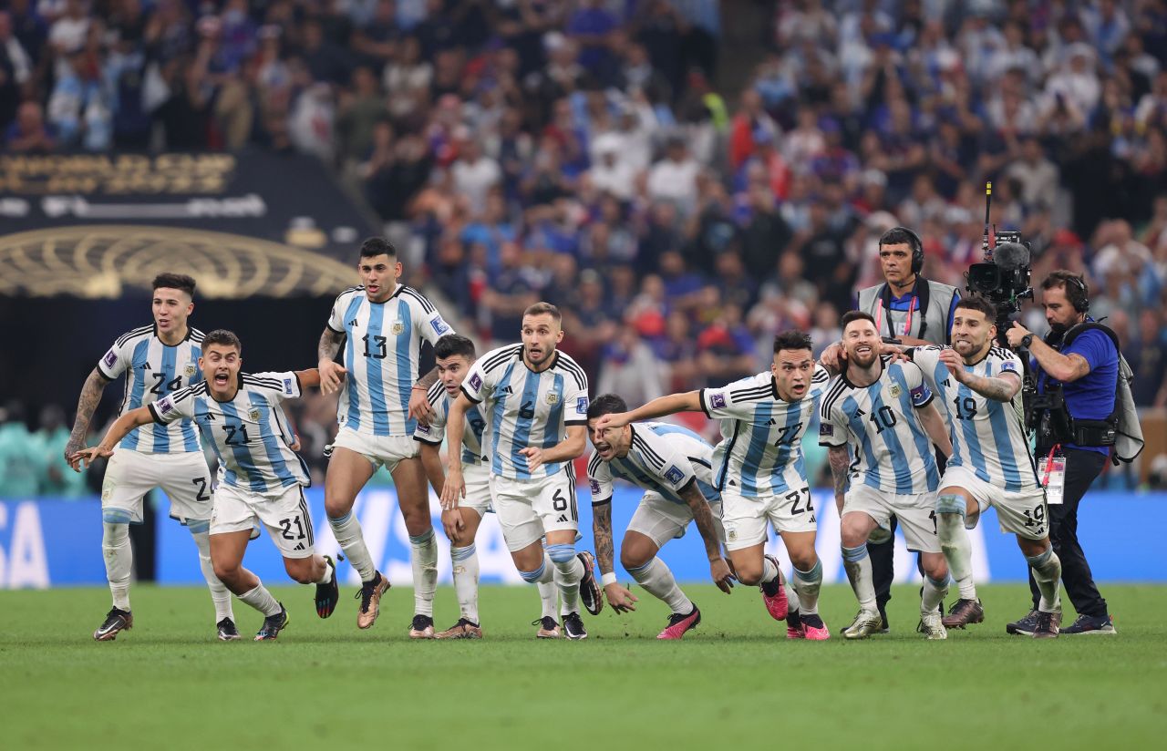 Argentina players react after Gonzalo Montiel scored his penalty to clinch the shootout victory.
