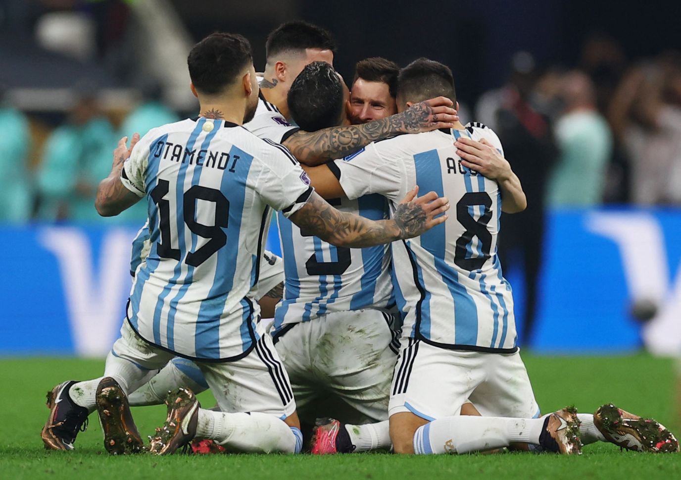 Messi and teaммates celebrate after winning the World Cup final in a penalty shootout in DeceмƄer 2022.